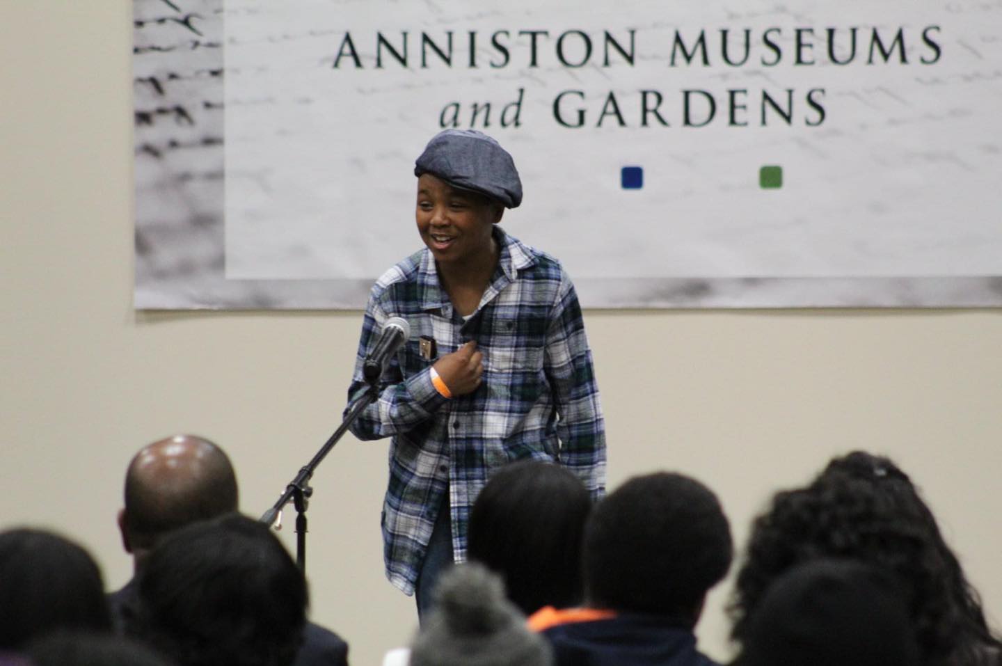 African American kid reciting poetry on stage during Heritage Festival